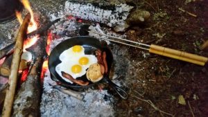 cooking breakfast over the open fire